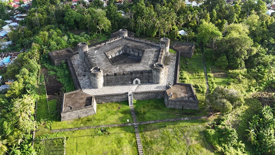 Stunning aerial view of the historic Fort Belgica surrounded by lush greenery in Banda Neira, Indonesia.